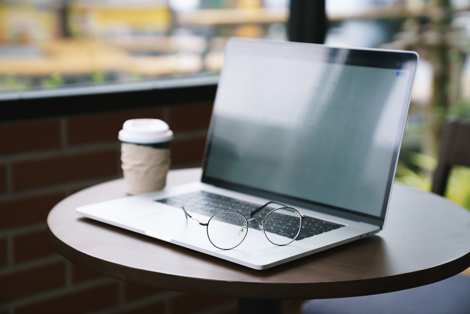 Laptop on Table in Cafe