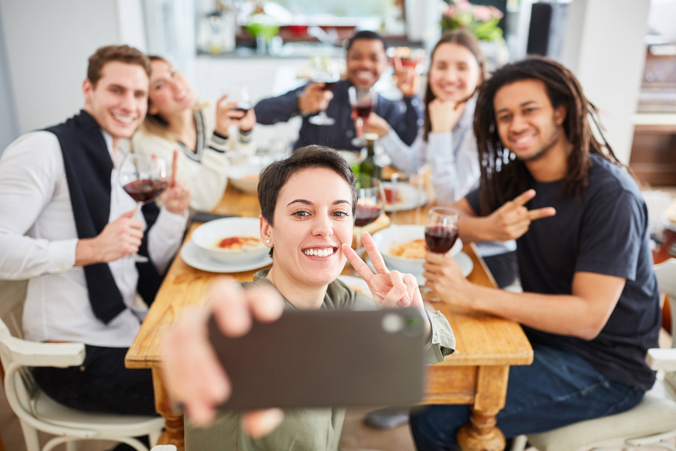 Students Take Selfie with Smartphone While Eating